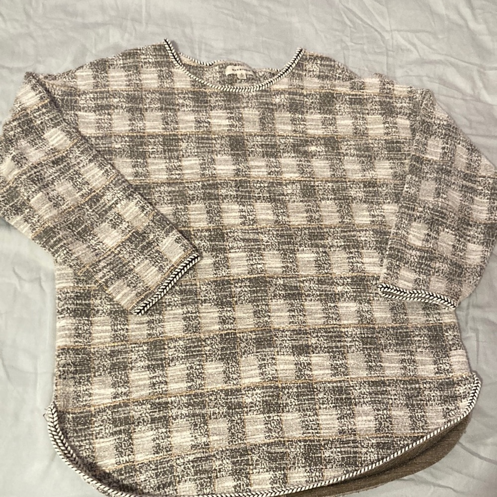 Black/white plaid top with streaks of mustard